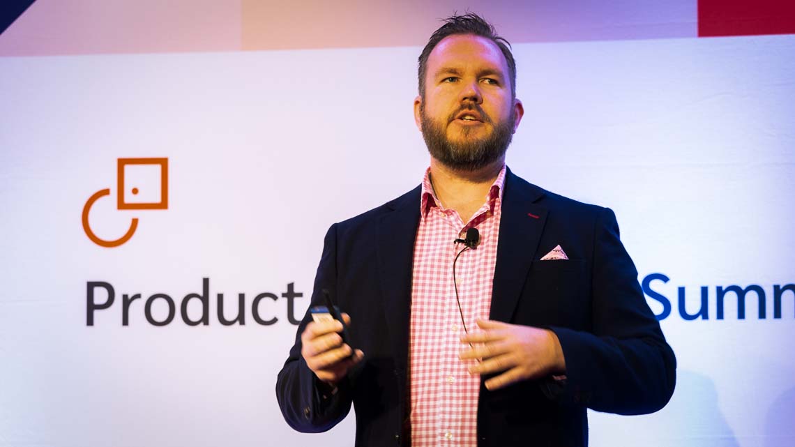 Andrew speaking at conference